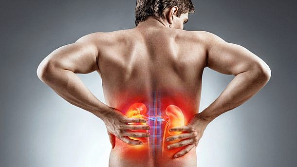 Kidneys pain. Man holding his back. Medical concept.