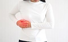 hepatitis and hepatomegaly, including cholangio carcinoma in woman and she touching in the upper right portion of abdomen and above stomach symptoms of pain and suffering use for health care concept.